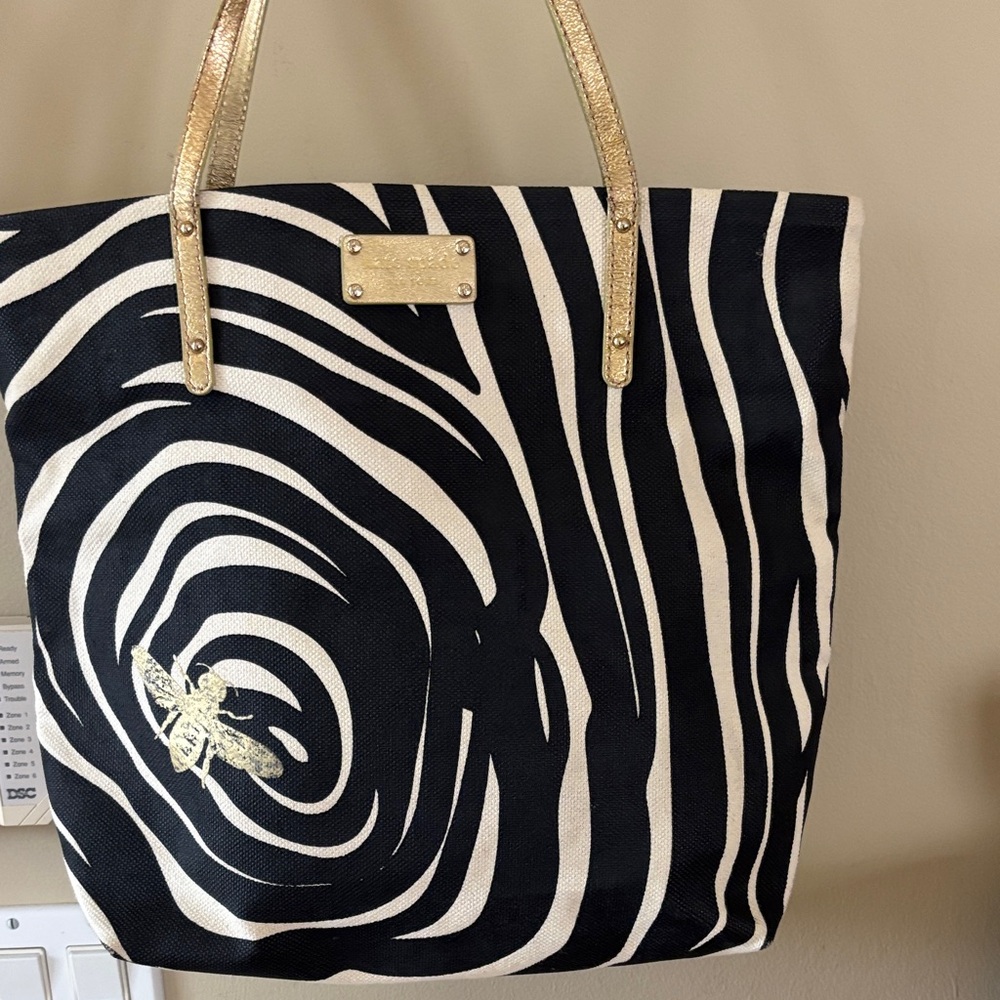 KATE SPADE NY Zebra Print with Gold Bee Embellishment.